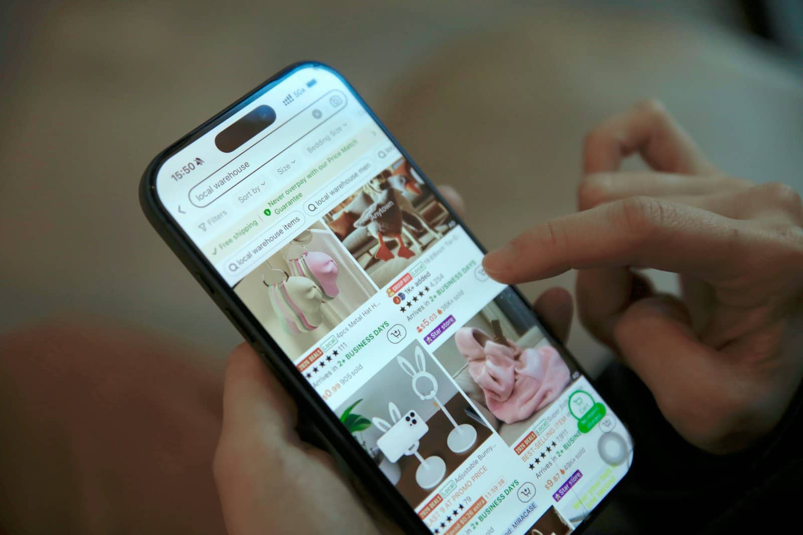 Hands holding a phone open on a shopping app